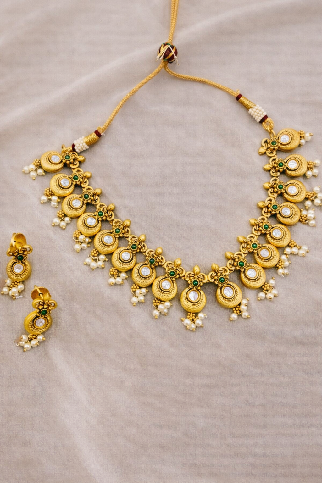Elegant Gold Necklace Set with Green Stone & Pearl Drops